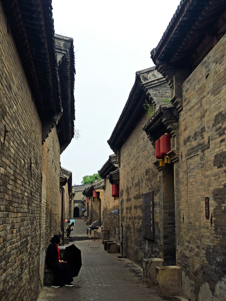 brick building with red lantern of Wang Family Compound