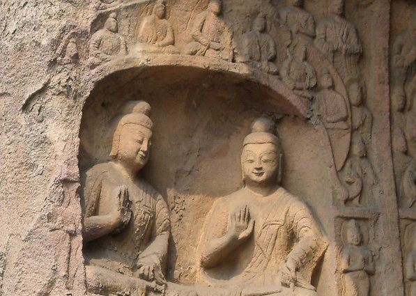 two stone Buddha statues with sweet smile of private Shanxi tour