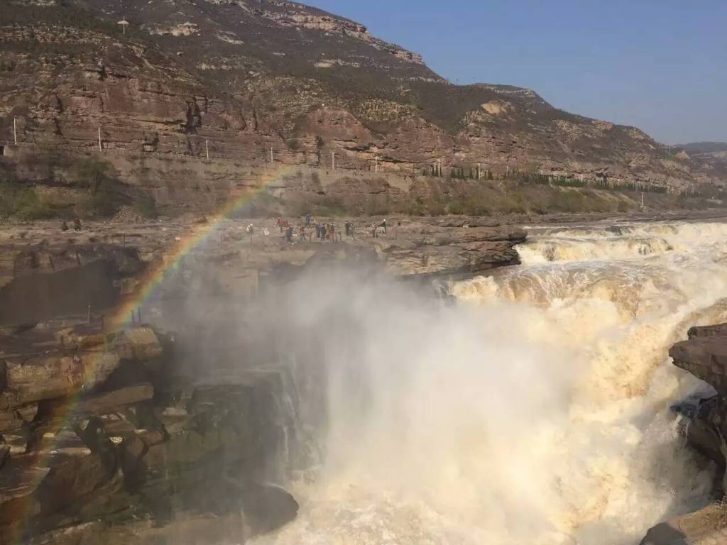 rainbow stay above the yellow river hukou waterfall of Shanxi trip