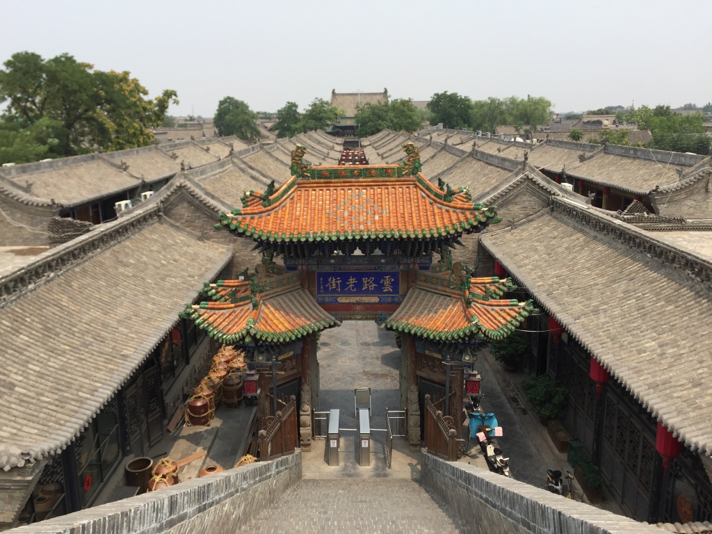 the golden archway and gray roof top at Pingyao of private Shanxi tour